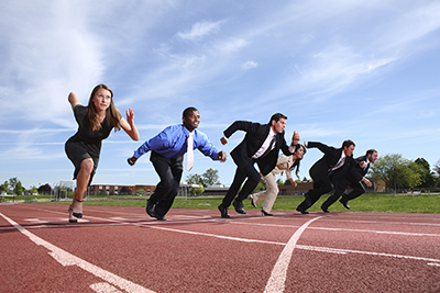 Business people on race track